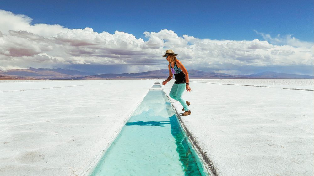 A solo female tourist in Salinas Grandes salt flats, Argentina