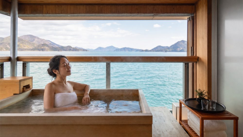 A lady enjoying a luxury ryokan experience aboard Guntû cruise in Japan