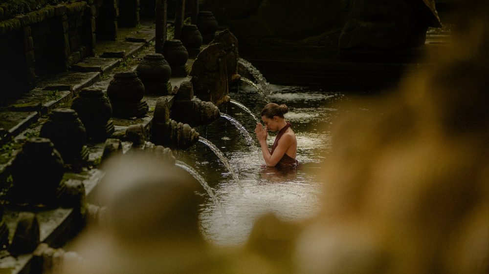 Melukat water blessing ritual in Tirta Empul by Aman, Indonesia